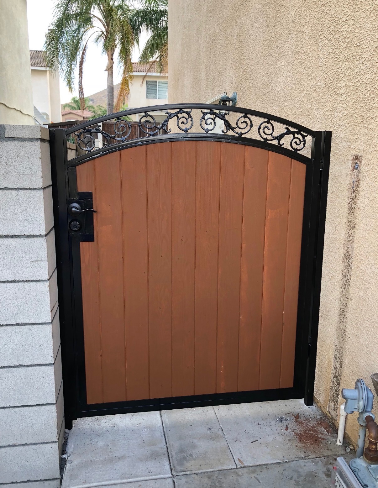 Wood & iron side gate with decorative scroll top