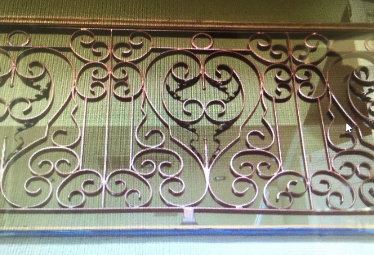 Copper-finish decorative wrought iron scrollwork panel